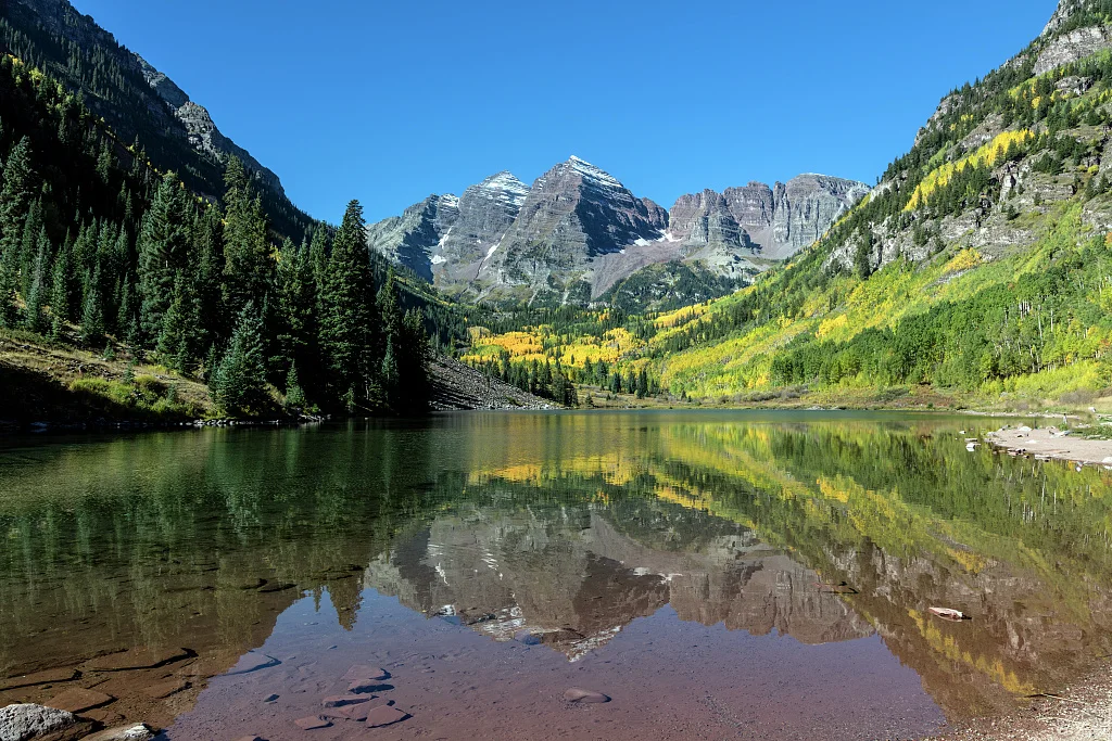Autumnal view of Rocky Mountain peaks called the Maroon Bells, between Pitkin County and Gunnison County, Colorado, southwest of Aspen