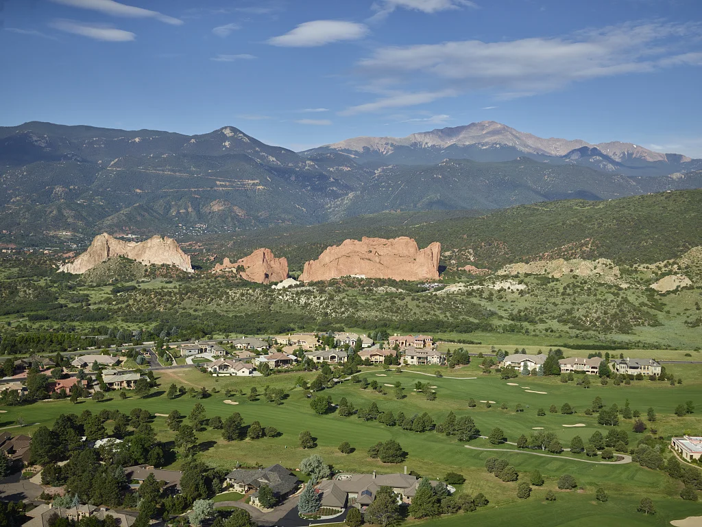 Aerial view of some of the standout red-rock formations at the Garden of the Gods, a municipally owned and free park in Colorado Springs, Colorado. For half a century or more, photographs of this place as well as the bridge over the chasm known as the Royal Gorge and Pikes Peak Mountain above Colorado Springs have served as powerful tourist magnets for the state