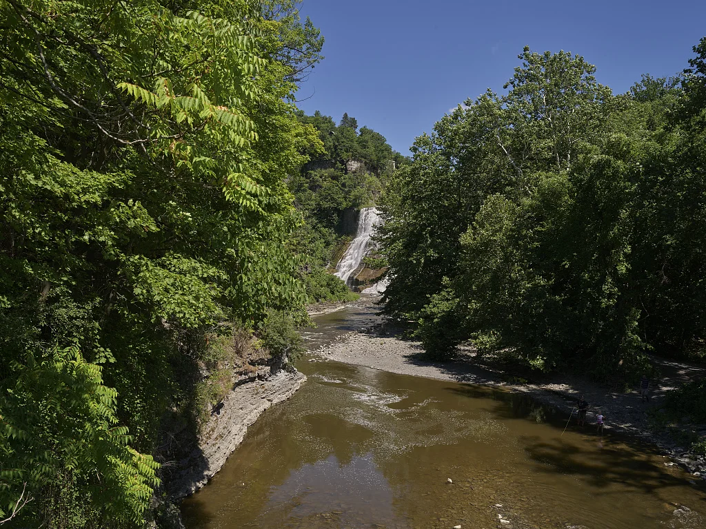 Ithaca Falls on Fall Creek, one of two prominent cascades that support a local slogan, "Ithaca is Gorges" (a play on the word "gorgeous") in Ithaca, New York