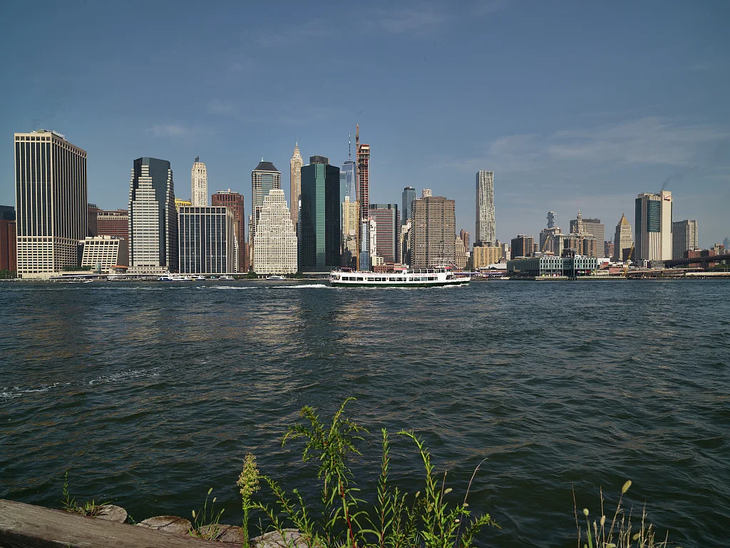 A view of the Manhattan skyline from Brooklyn Bridge Park in Brooklyn, one of New York City's boroughs or county-like administrative units. Brooklyn was once an independent city rivaling nearby Manhattan in size and importance until it was incorporated into the five-borough sprawling New York megalopolis in 1898