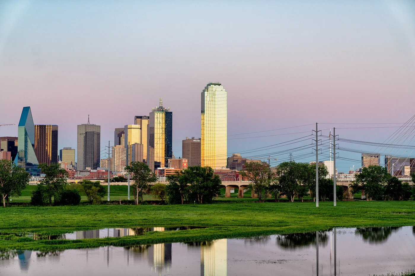 Dallas skyline reflected beside Trammell Crow Park