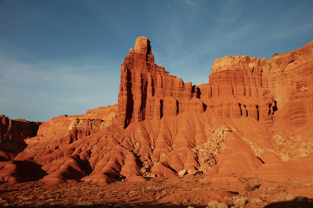 Craggy cliffs surmount a butte in Capitol Reef National Park, one of the majestic "Mighty Five" national parks popular with visitors, near the town of Torrey in the western U.S. state of Utah