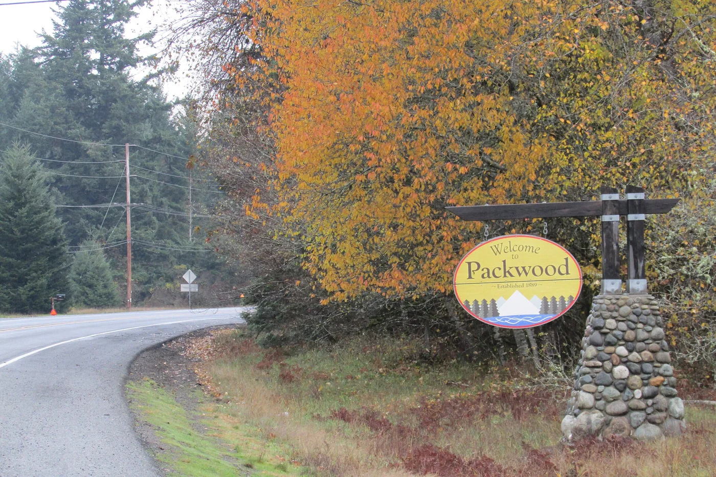 Autumn trees and the welcome sign in Packwood, Washington