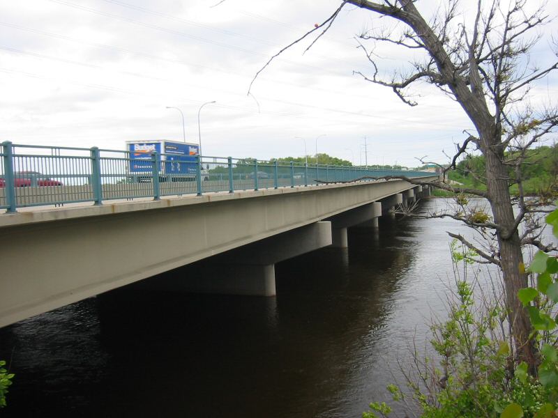 w:Richard P. Braun Bridge (1999 bridge) over the w:Mississippi River in w:Brooklyn Park, Minnesota .