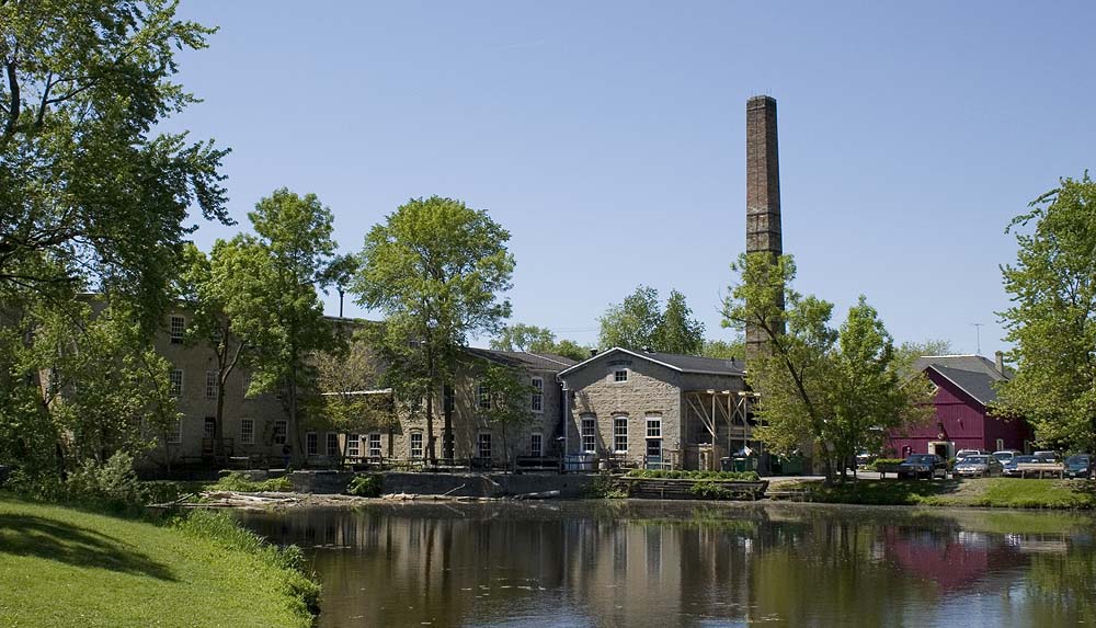 The Hilgen-Wittenberg Woolen Mill complex in Cedarburg, Wisconsin. National Registered Historic Place. View looking west across the mill pond.