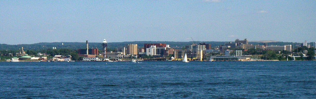 This photograph of the skyline of Erie, Pennsylvania as seen from Presque Isle was taken by Pat Noble (self) on 24 June 2007.