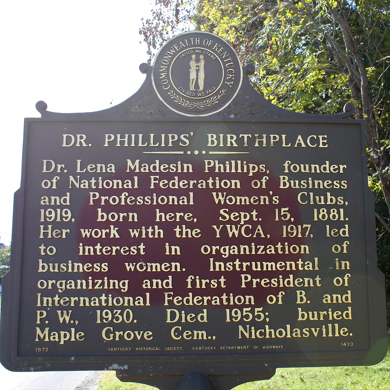 Historical marker at the birthplace of Lena Madesin Phillips in Nicholasville, Kentucky. The marker summarizes Phillips's life and work and was erected by the Kentucky Historical S